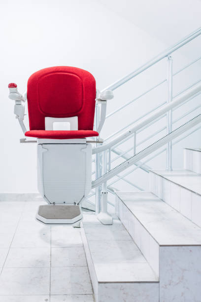 istock Red stair chair lift  for people with disability 1443494287