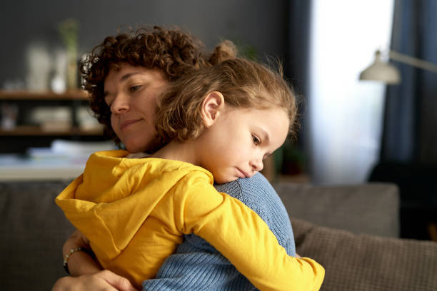 Young mom calming her child