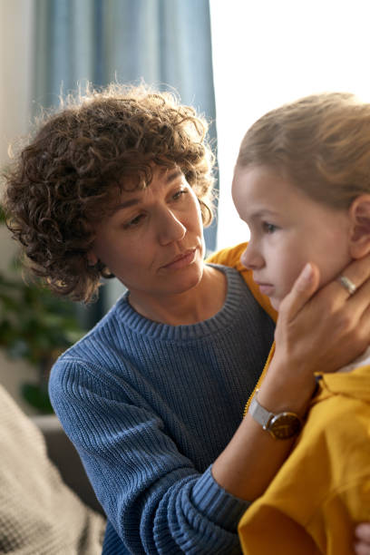 istock Caring mother talking to her son 1443494649