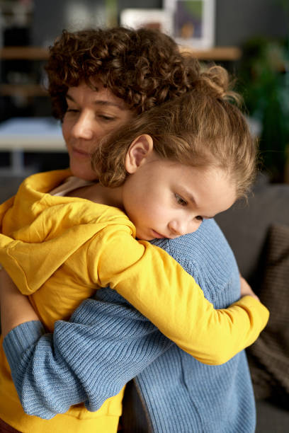 istock Sad child emracing his mother 1443494670