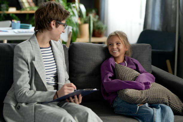 Social worker talking to child at home