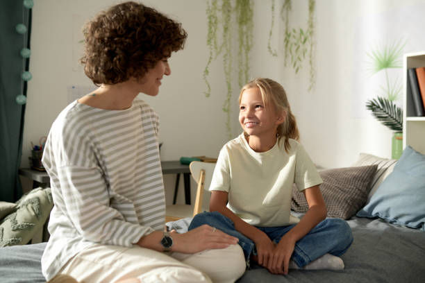 istock Mother talking to her daughter at home 1443495484