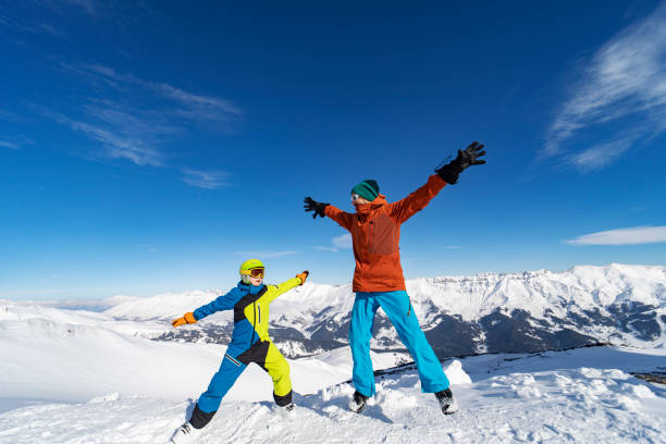 istock Father and son enjoying ski holidays in mountains 1443495642