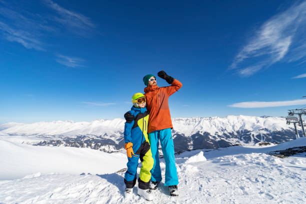 istock Father and son enjoying ski holidays in mountains 1443495643