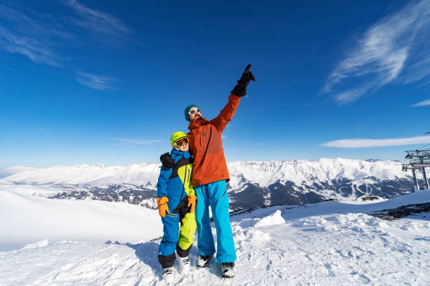 istock Father and son enjoying ski holidays in mountains 1443495646