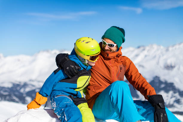 istock Father and son enjoying ski holidays in mountains 1443495659