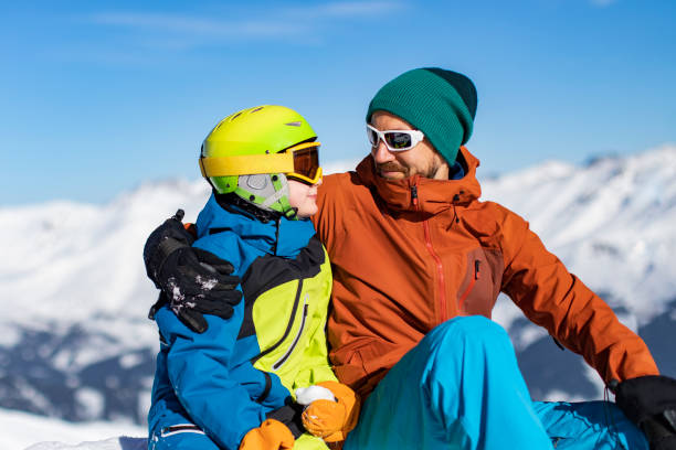 istock Father and son enjoying ski holidays in mountains 1443495673