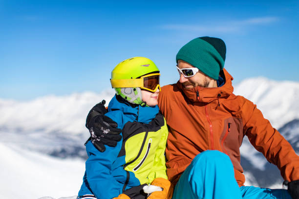 istock Father and son enjoying ski holidays in mountains 1443495675