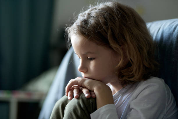 Child in depression sitting in room Child in depression sitting in his room, he feeling lonely and bored animal behavior stock pictures, royalty-free photos & images