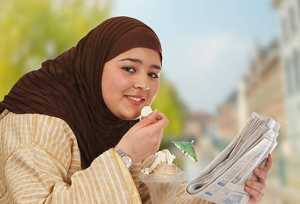 スイートの昼食 - women eating ice cream indigenous culture ストックフォトと画像