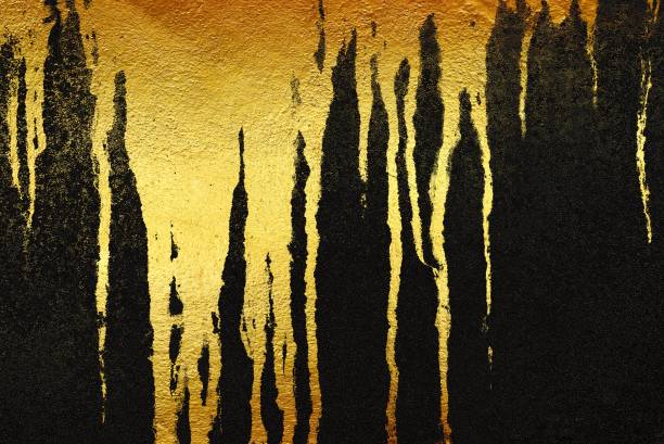 istock Gold Stain on Black Concrete Wall Texture Background. 1443497591