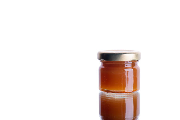 istock jar of jam on white isolated background with reflection 1443498449