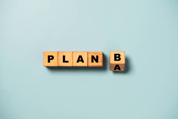 istock Flipping of wooden cube block from plan A to B on blue background for backup plan selection of business planing concept. 1443498560