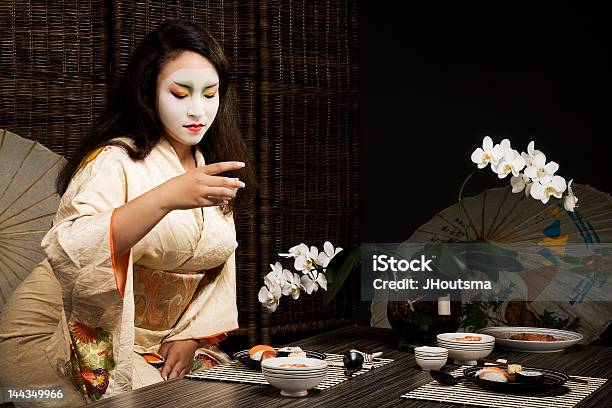 Beautiful Young Geisha Girl In Kimono Drinking Saki Stock Photo - Download Image Now