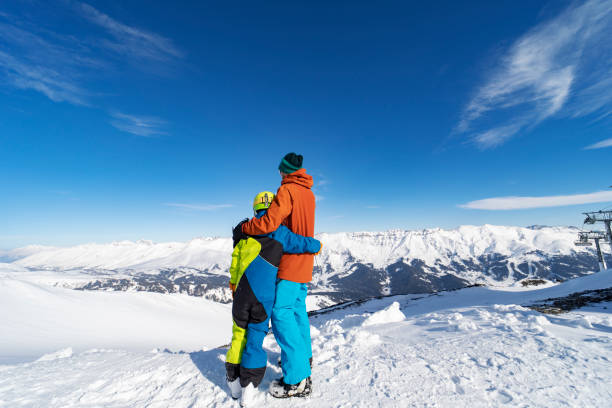 istock Father and son enjoying ski holidays in mountains 1443500619
