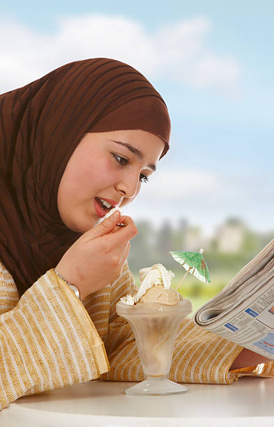 新聞やアイスクリーム - women eating ice cream indigenous culture ストックフォトと画像