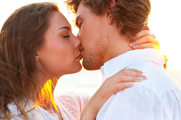 istock Couple kissing on the beach 144350266