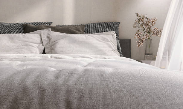 istock White fabric blanket and pillow on modern and luxury design bed with bedside table in bedroom with sunlight from window sheer curtain on beige wallpaper wall 1443503455