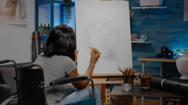istock African american artist with disability drawing vase design 1443504095
