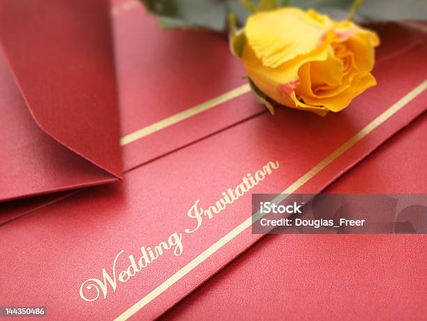 A Red Wedding Invitation With Yellow Flowers Stock Photo - Download Image Now - Wedding Invitation, Bud, Celebration