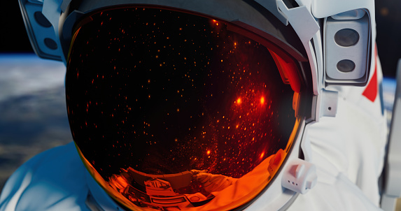 Beautiful spaceman helmet in close-up with stars reflection