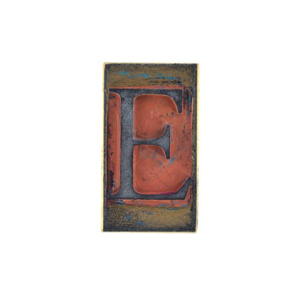 istock old capital letter with serif on a retro rubber stamp with white background, alphabet - E 1443506668