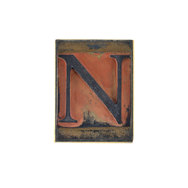 istock old capital letter with serif on a retro rubber stamp with white background, alphabet - N 1443507221