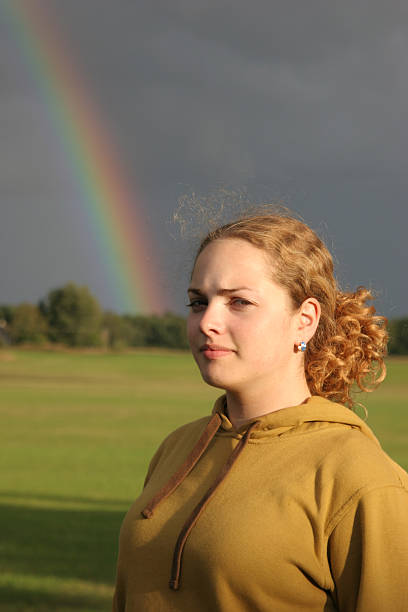 istock tenager girl and rainbow 144350793