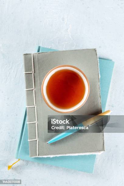 A Diary Journals With A Pen And A Cup Of Tea Minimalist Style Top Shot Stock Photo - Download Image Now
