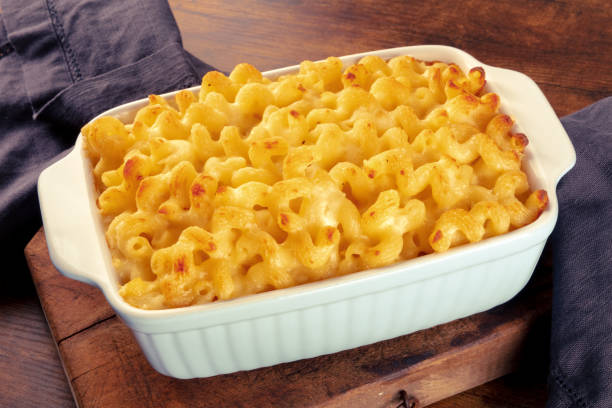 istock Macaroni and cheese pasta in a casserole, on a rustic wooden table 1443511290