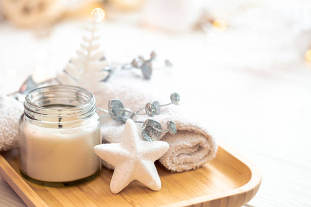 istock Christmas spa composition with a candle on blurred background, close-up. 1443511608