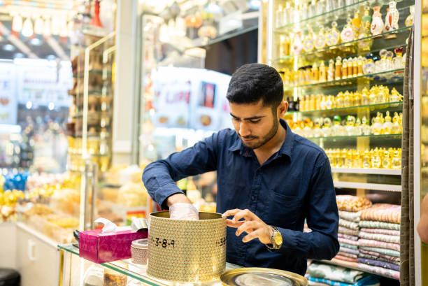 Young Arab man working in a spices store