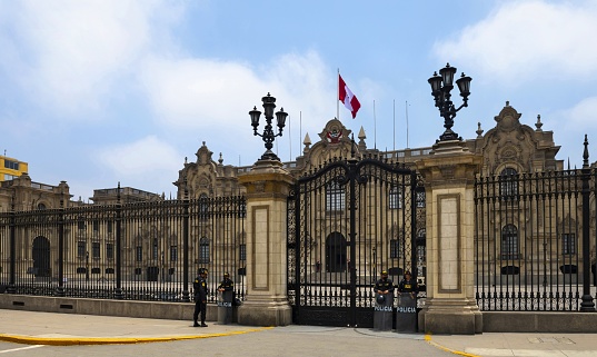 Lima, Peru, November 2, 2021: View of the gate into the presidential palace on Plaza Mayor in the downtown of Peruvian capital.