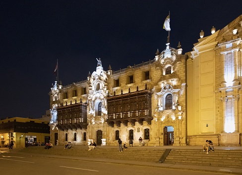Lima, Peru, November 2, 2021: View of the Archbishop's Palace on the Plaza Mayor in the historic center of the Peruvian capital by night. The historic center of Lima is listed as UNESCO World Heritage Site.