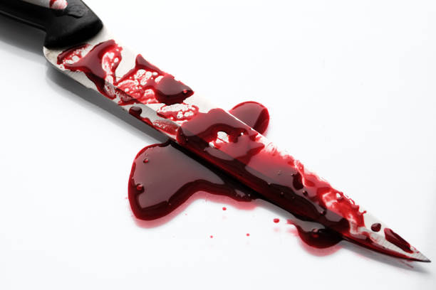 istock drops of red blood on a knife blade 1443512610