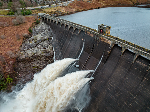 Aerial view of a gravity fed hydroelectric dam, which pumps water through the turbines and generates clean, renewable energy from stored water
