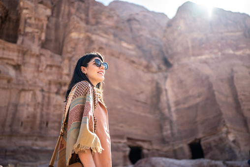 Mid adult woman tourist admiring Petra, Jordan
