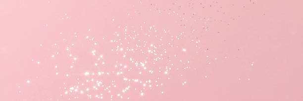 Sparkling silver glitter on pink background banner