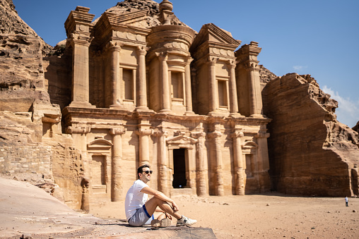 Mid adult man tourist admiring Petra, Jordan