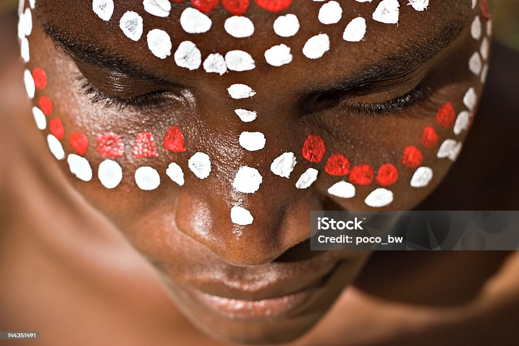 Tribal face Young African girl, tribal painted face in white and red Indigenous Culture Stock Photo