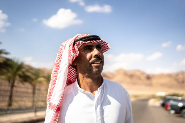 Mature middle eastern man contemplating outdoors