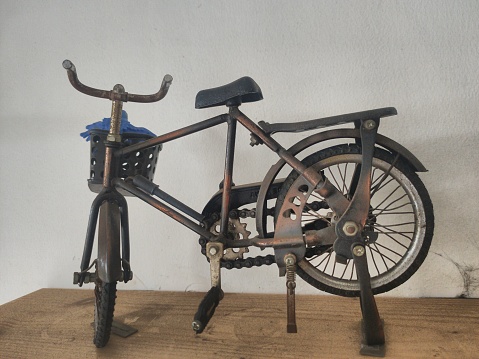 depok, Indonesia- 20 November 2022: old bicycle displays, miniature bicycles from wood crafts, for wall displays, the size may be the size of a palm