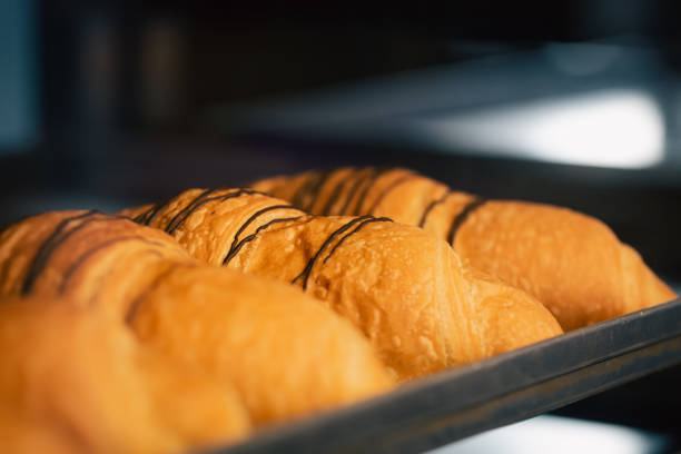 istock Close-up, freshly baked croissants in a bakery on a blurred background. 1443516466