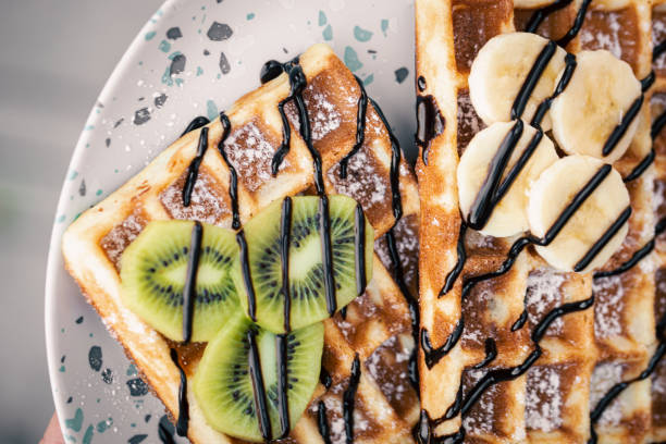 istock Close-up, Belgian waffles with fruits, covered with chocolate. 1443516485