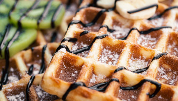 istock Close-up, Belgian waffles with fruits, covered with chocolate. 1443516497