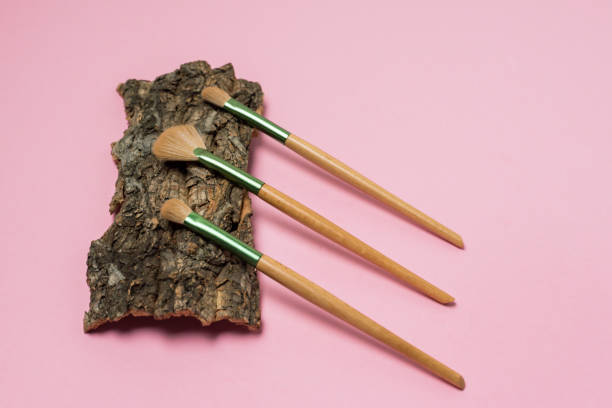 istock Set of Eco Natural Bamboo Make up Tools bag on Tree Bark Pink Background Top view Copy spac Eco-friendly Copy Space 1443517095