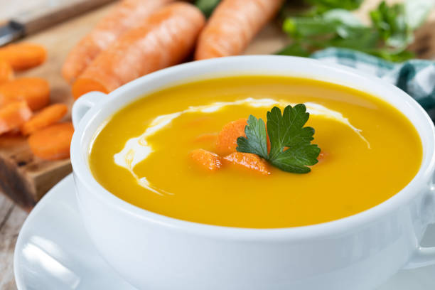 istock Carrot soup with cream and parsley 1443517172