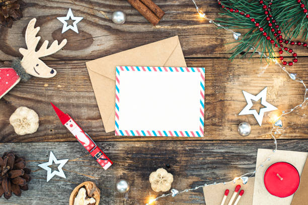 istock Blank paper, envelope and Christmas decor on wooden background, copy space. 1443517247