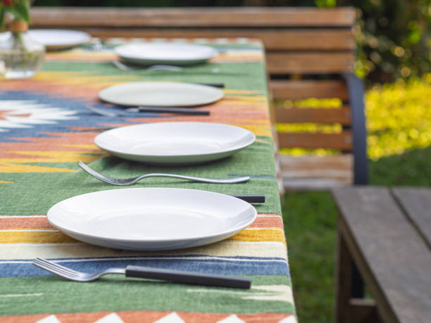 istock Decorated wooden table set up for a garden party or dinner reception 1443517503