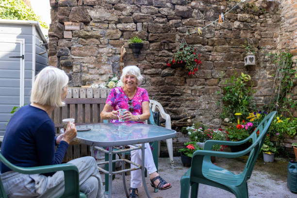 istock Two Senior Friends in The garden 1443517561